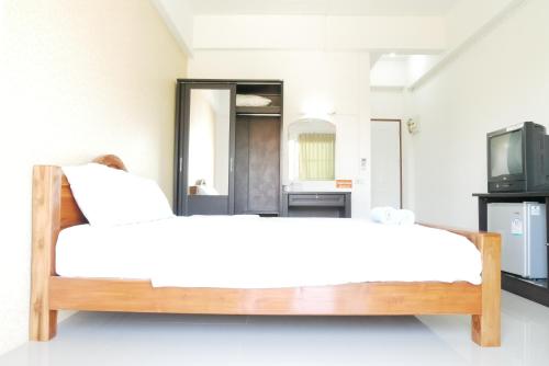 Ένα ή περισσότερα κρεβάτια σε δωμάτιο στο Fang Villa Hotel