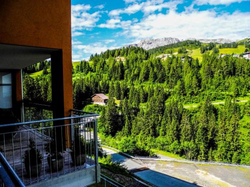 a balcony of a building with a view of a mountain at Appartements Nassfeld LUX in Sonnenalpe Nassfeld