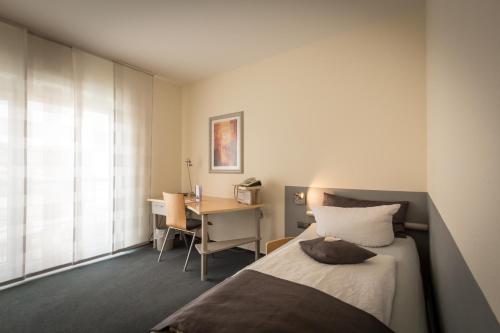 מיטה או מיטות בחדר ב-Business Vital Hotel am Rennsteig
