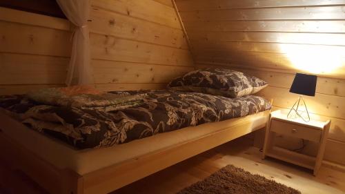 Postelja oz. postelje v sobi nastanitve Domki u Asi