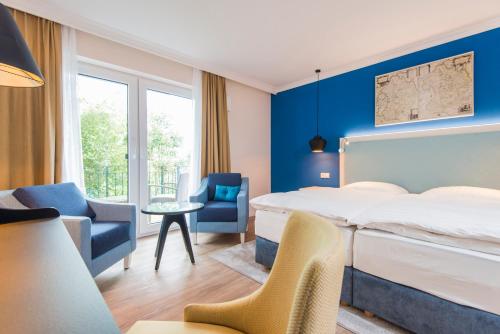 Postel nebo postele na pokoji v ubytování Boutique-Hotel Zur alten Post