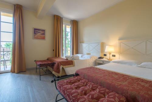Hotel Villa Cappugi tesisinde bir odada yatak veya yataklar