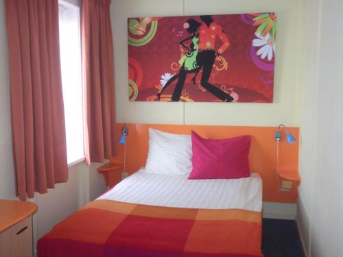 Кровать или кровати в номере Hotel Hoogland Zandvoort aan Zee