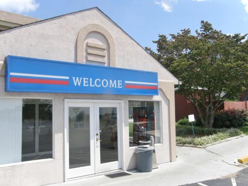 a welcome sign on the front of a store at Motel 6-Gainesville, GA in Gainesville