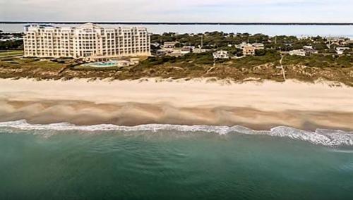 an aerial view of a hotel and the beach at The Beacon in Salter Path