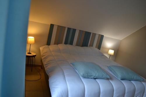 Postel nebo postele na pokoji v ubytování Gîte La Clef des Champs
