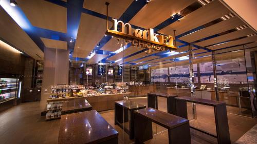 a restaurant with wooden tables and a bar at Hyatt Regency Chicago in Chicago