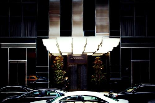 a building with cars parked in front of it at Park Hyatt New York in New York