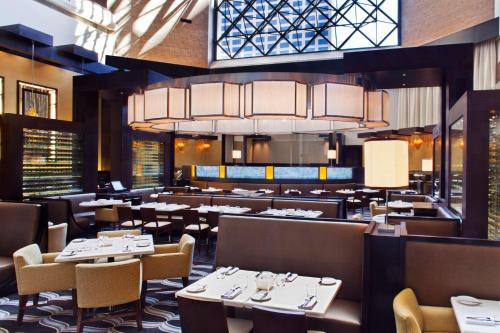 
a restaurant with tables, chairs, and tables in it at Hyatt Regency New Orleans in New Orleans
