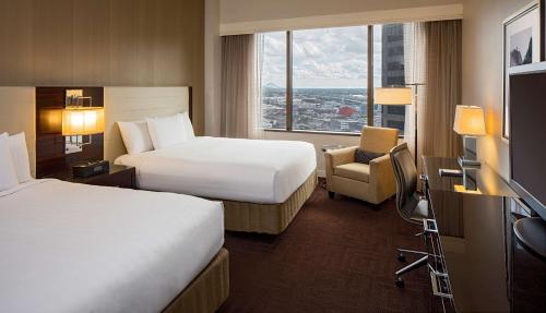 a hotel room with two beds and a television at Hyatt Regency New Orleans in New Orleans