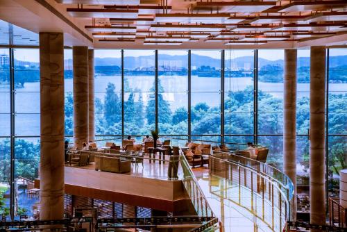 a restaurant with a view of the mountains at Hyatt Regency Dongguan in Dongguan