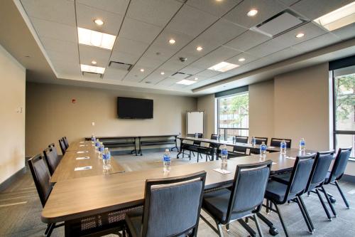 a large conference room with a long table and chairs at Hyatt House Chicago/Evanston in Evanston