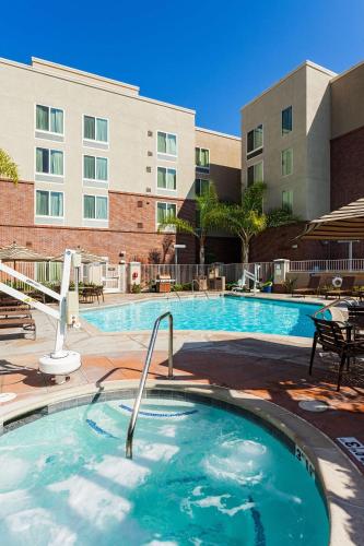 a large swimming pool in front of a building at Hyatt Place San Diego-Vista/Carlsbad in Vista