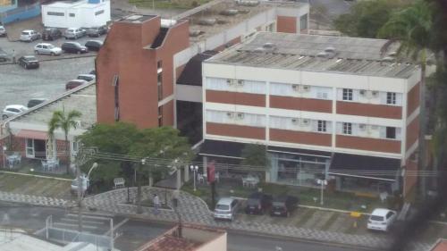 an aerial view of a parking lot with a building at Ancona Center Hotel in Amparo