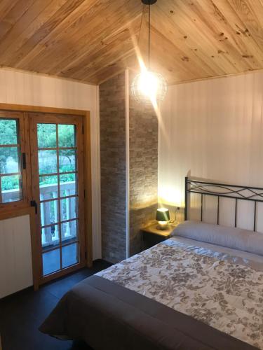 A bed or beds in a room at A Leira