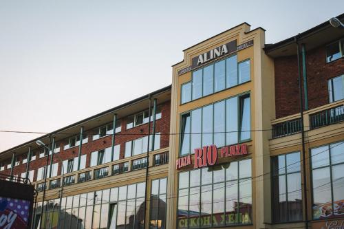 a building with a sign on the front of it at Alina Hotel & Hostel in Uzhhorod