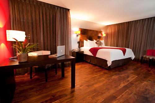 Postel nebo postele na pokoji v ubytování La Inmaculada Hotel