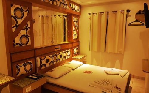 Cama ou camas em um quarto em Hotel Flor