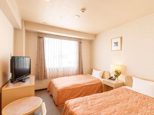 仙台珍珠城市飯店房間的床