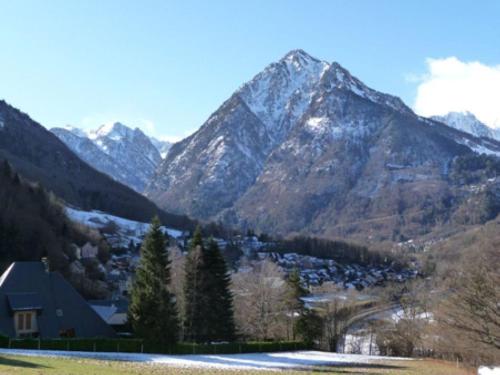 a view of a mountain range with a house at Chambres d'Hôtes La Balaguère in Cauterets