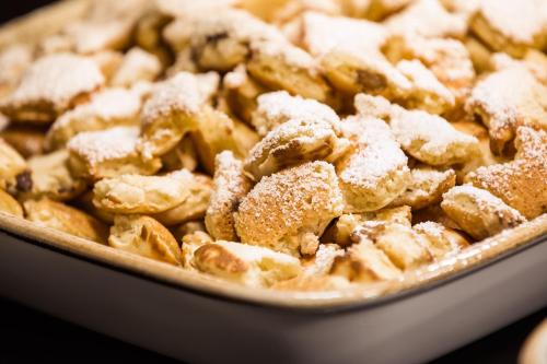 a close up of a dish of food with powdered sugar at Lindner Hotel Vienna Am Belvedere, part of JdV by Hyatt in Vienna