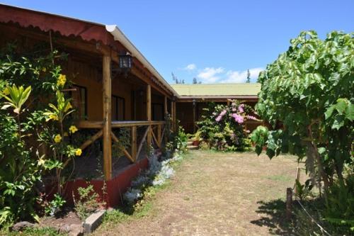 a house with a yard in front of it at Chez Jérôme in Hanga Roa