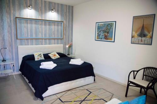 En eller flere senge i et værelse på Villa Di Giorgi Apartments