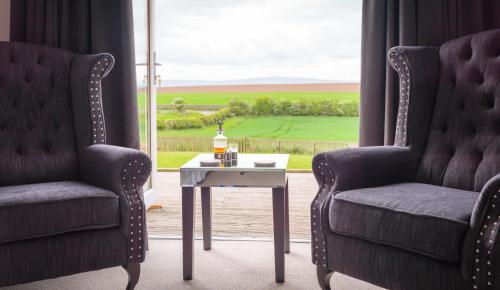 Ein Sitzbereich in der Unterkunft Garleton Lodge