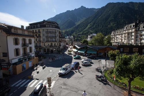 a city with cars parked in a parking lot at Pointe Isabelle in Chamonix-Mont-Blanc