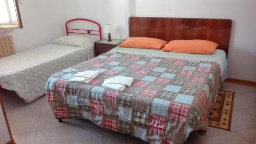 Un ou plusieurs lits dans un hébergement de l'établissement Agriturismo Cerquaglia