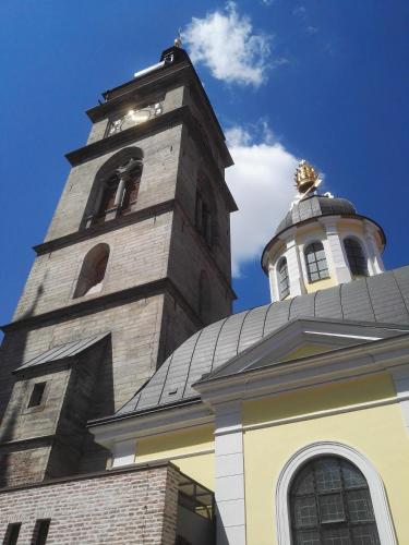 a building with a clock tower on top of it at Hotel Vacek Pod Věží in Hradec Králové