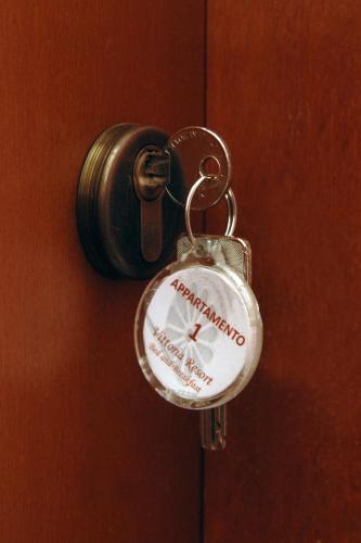 a key chain is attached to a door at Vittoria Resort Residence-B&B in Galatina