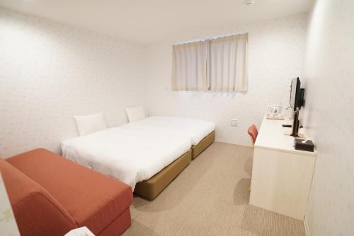 Postel nebo postele na pokoji v ubytování CVS Bay Hotel New Building