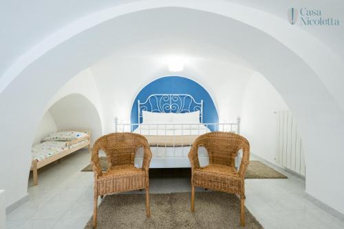 Posteľ alebo postele v izbe v ubytovaní Casa Nicoletta