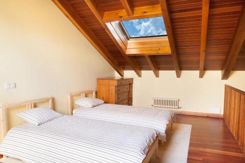 Postel nebo postele na pokoji v ubytování Casa Roble