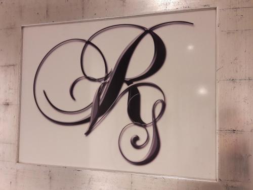 a sign with the letter k on a wall at Residenza Vatican Suite in Rome