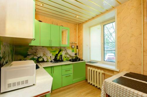 A kitchen or kitchenette at Business Brusnika Comfort Class Apartment Nagornaya