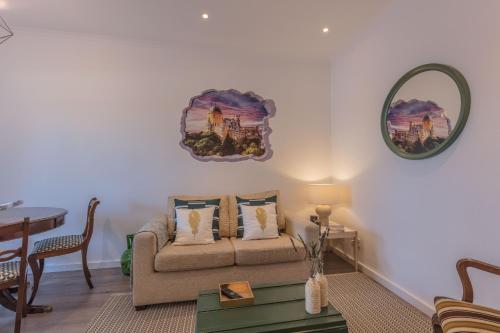 a living room with a couch and a table at Sintra Wine Apartment in Sintra