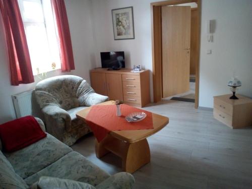 a living room with a couch and a coffee table at Alter Topf in Quedlinburg