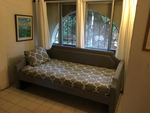 a bench in a room with a window at Bay View in St Thomas