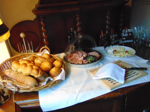 a table with a basket of bread and other foods at Zunfthaus zur Rebleuten in Chur