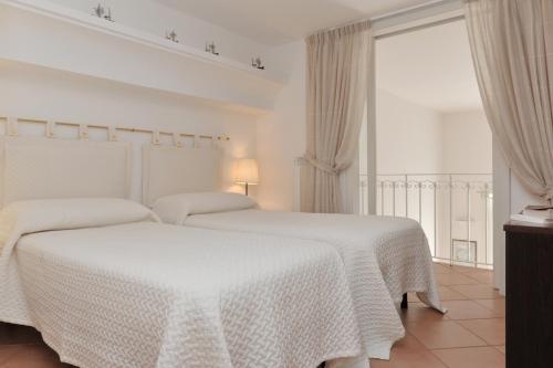 Ένα ή περισσότερα κρεβάτια σε δωμάτιο στο La Torricella - Ravello Accommodation