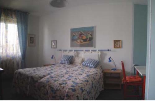 Łóżko lub łóżka w pokoju w obiekcie Guesthouse La Rocca