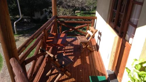 an open door to a balcony with a wooden railing at Complejo La Colina in Federación