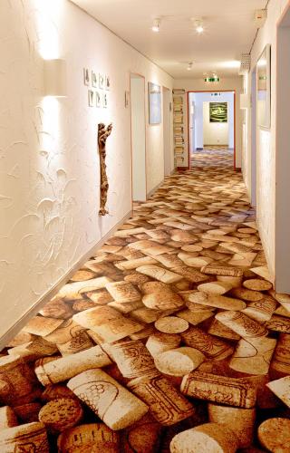a hallway with a floor made out of logs at Park Hotel Post in Freiburg im Breisgau