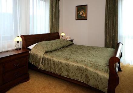 Una cama o camas en una habitación de Hotel Salamandra