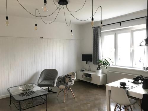 TV a/nebo společenská místnost v ubytování Apartament Prusa No 9