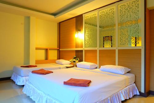 two beds in a room with white sheets at Aonang Top View in Ao Nang Beach
