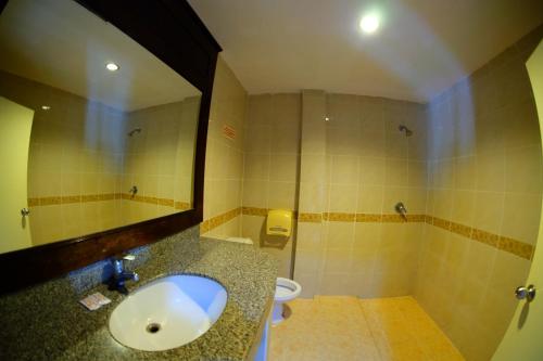 a bathroom with a sink and a toilet at P.K. Mansion in Ao Nang Beach