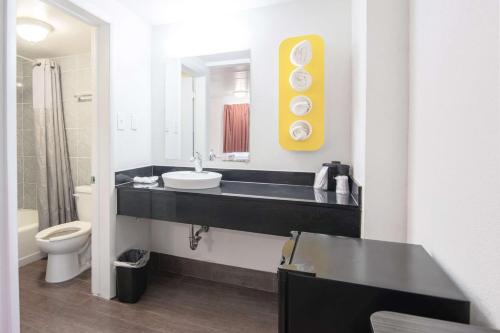 a bathroom with a sink and a toilet at Motel 6-Glassboro, NJ - Rowan University in Glassboro
